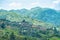 Village in the valley. Living in the forest. Small house in the mountain with sunlight. Small home in the hill with blue sky and c