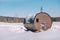 Village in the winter. Houses in Siberia under the snow. Buildings in the snow