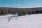 Village in the winter. Houses in Siberia under the snow. Buildings in the snow