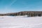 Village in the winter. Houses in Siberia under the snow. Buildings in the snow