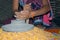 A village woman`s hand, grinds gram in an old hand operated flour mill