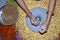 A village woman`s hand, grinds gram in an old hand operated flour mill