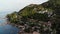 Villas on green mountain ridge. Majestic drone view of luxury villas located on green mountain range on tropical paradise island