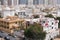 Villas residential area of Abu Dhabi with modern tower blocks in background. Modern middle eastern urban architecture.