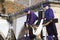 VILLAVICIOSA, SPAIN - 19 APRIL 2019: Desenclavo Procession, Easter Week in Villaviciosa, Asturias. A brother passes the hammer to