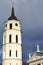 VILNIUS, LITHUANIA - JANUARY 3, 2017: The Belfry Cathedral Clock Tower and the Cathedral on Cathedral Square with a stormy sky