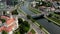 VILNIUS, LITHUANIA - JULY, 2019: Aerial drone view of the church of Archangel Raphael and bridge over the Neris river.