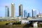 Vilnius spring panorama with skyscrapers on Neris river board