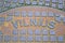 Vilnius text message on vintage damaged metal manhole surface closeup, retro technology diversity,
