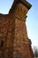 Vine Covered Brick Column Among Building Ruins