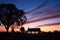 vineyard cottage, silhouetted against a twilight sky