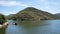 Vineyard mountain on the Douro River with an antique boat