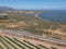 Vineyard, mountains, blue skies and lagoon