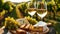 A vineyard picnic with a platter of cheeses, fresh bread, and glasses filled with white wine