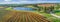 Vineyard and pond on bright sunny day in fall.