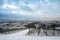 Vineyard with view of the ancient roman city of Trier covered in snow, Moselle Valley in Germany, winter landscape in rhineland