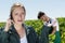 Vineyard worker angry while talking on phone