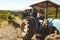 Vineyard worker transporting grapes to wine factory