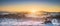 Vineyards rows covered by snow in winter at sunset. Chianti, Siena, Italy