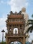 Vinh Trang Temple Entrance Gate and Standing Buddha Statue From Behind