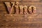 Vino lettering made of corks on wooden background