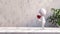 Vino Reverie: White Stick Figure Sips Elegance Against Concrete Backdrop