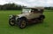 Vintage 1914 Sunbeam Motor car in isolated in field.