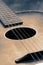 Vintage acoustic guitar on a wooden floor