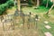 Vintage Aged metallic chair situated in garden. Forged iron park