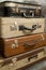 Vintage, aged suitcases on stack