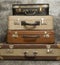 Vintage, aged suitcases on stack