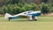 A vintage aircraft, Miles Falcon Major M3A - 1936 landing at airfield