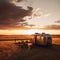 Vintage Airstream Trailer Parked in the Middle of a Sprawling Prairie Landscape with Sunset View