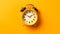 A vintage alarm clock set against a bold yellow background, evoking nostalgia and retro charm.