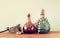 Vintage antigue perfume bottles, on wooden table. retro filtered image.