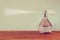 Vintage antigue perfume bottles, on wooden table. retro filtered image