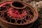 Vintage antique automotive wire wheel spokes and hub with red peeling paint and rust