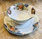 Vintage Antique Fine Bone China with Gold Trim and Flowers Teacup and Saucer on Burlap Background