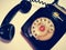 A vintage and antique telephone with white background.