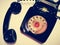 A vintage and antique telephone with white background.