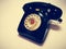 A vintage and antique telephone with white background.