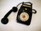 A vintage and antique telephone with white background.