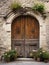 Vintage arched door in French medieval style, authentic stone house porch, vertical image