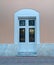 Vintage arched entrance white painted wood and glass door