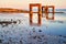 Vintage arches of the former landing bridge in EckwarderhÃ¶rne Germany in evening sunlight