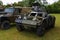 : Vintage armoured scout car parked on grass.
