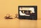 Vintage audio cassette on brown background