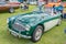 A vintage Austin Healy 3000 convertible car on display at a public car show