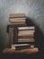 Vintage Background with Old Books. Stack of Books Folded on a Chair. Fragments of the Interior of the Old Library