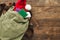 Vintage backpack with santa claus hat and passports wooden table. Copy space